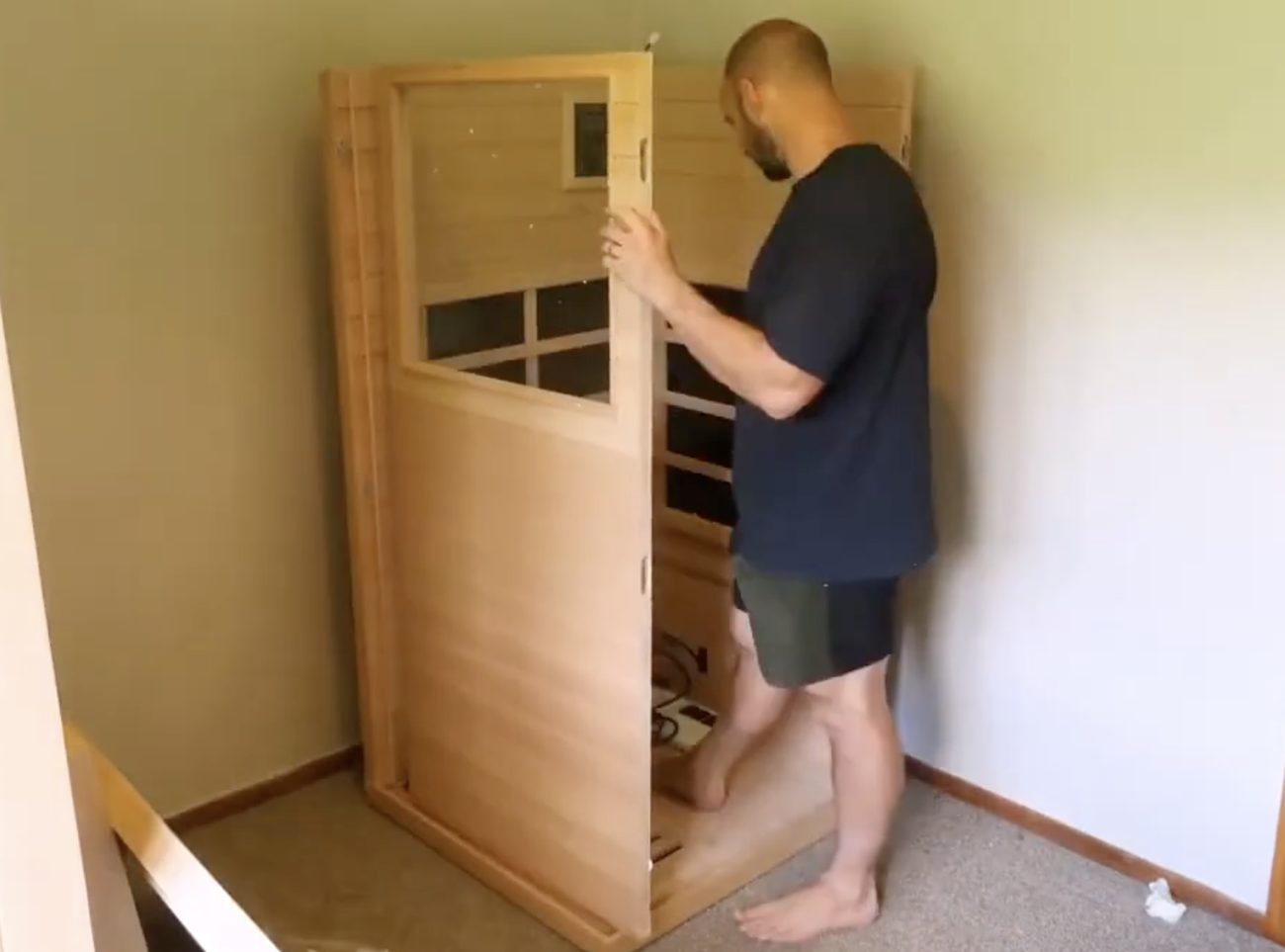 Sauna panels being assembled inside an apartment