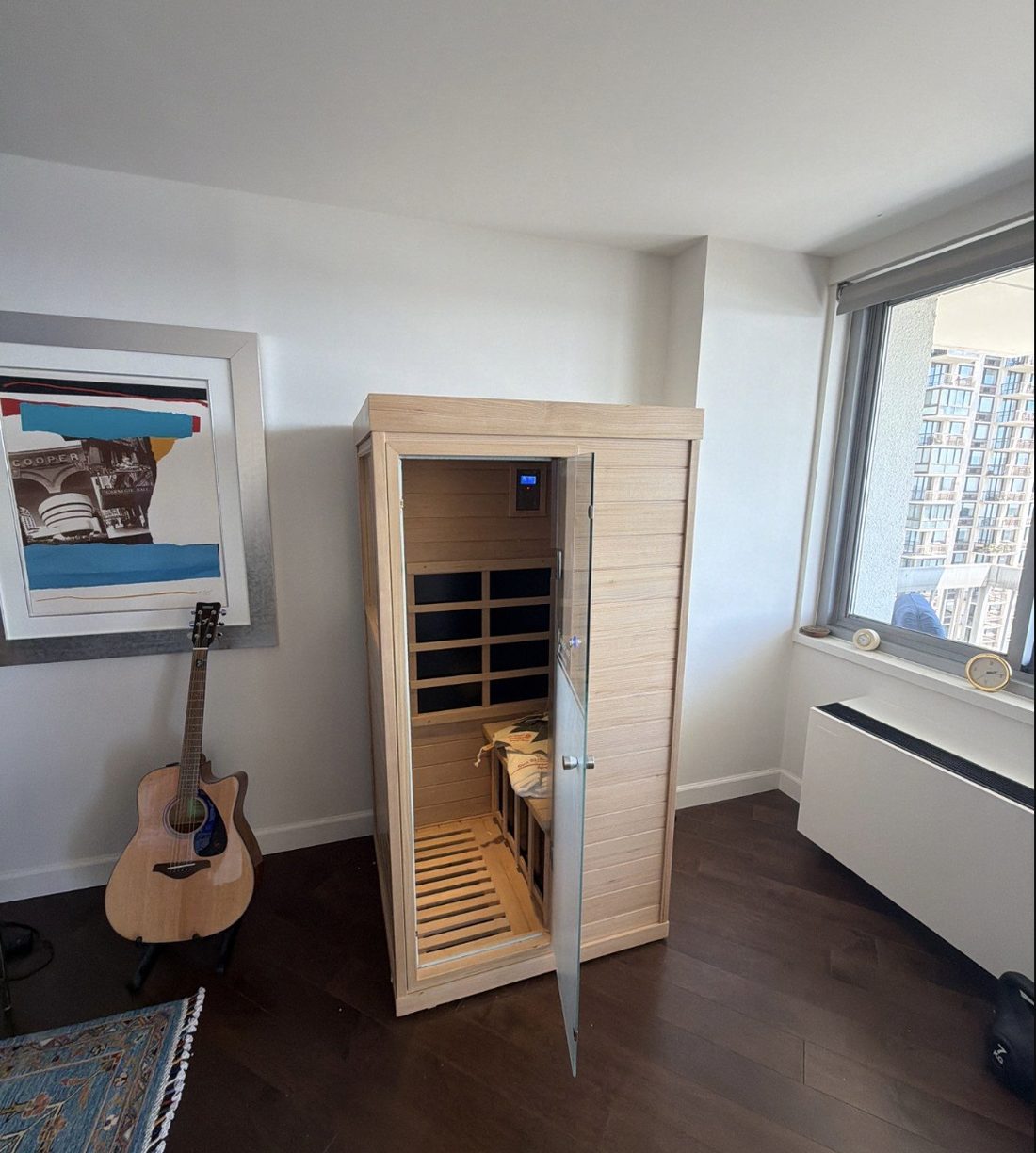 Close-up of the Evolve Mini sauna, solid Canadian hemlock, in Justin's apartment
